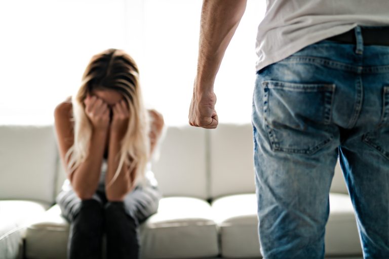 Man beating up his wife illustrating domestic violence